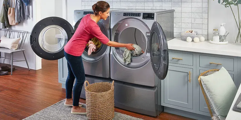 woman-changing-over-laundry-whirlpool-laundry-pair